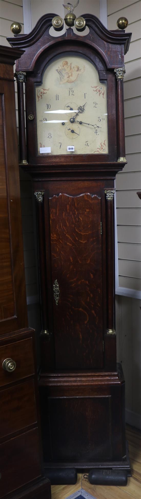 A late 18thc oak eight day longcase clock with arched painted enamelled dial, 230 cm high